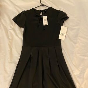 Vintage Lord & Taylor LBD: structured sleeve, high neckline, precious knee lngth